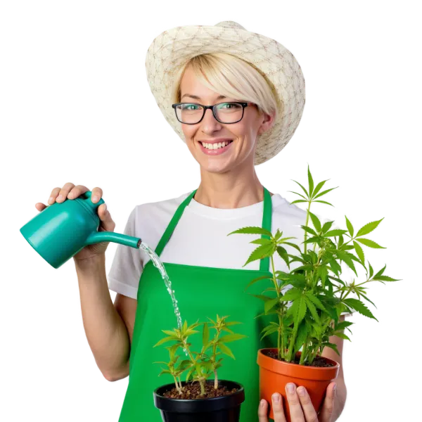 Person watering potted plants with green watering can.